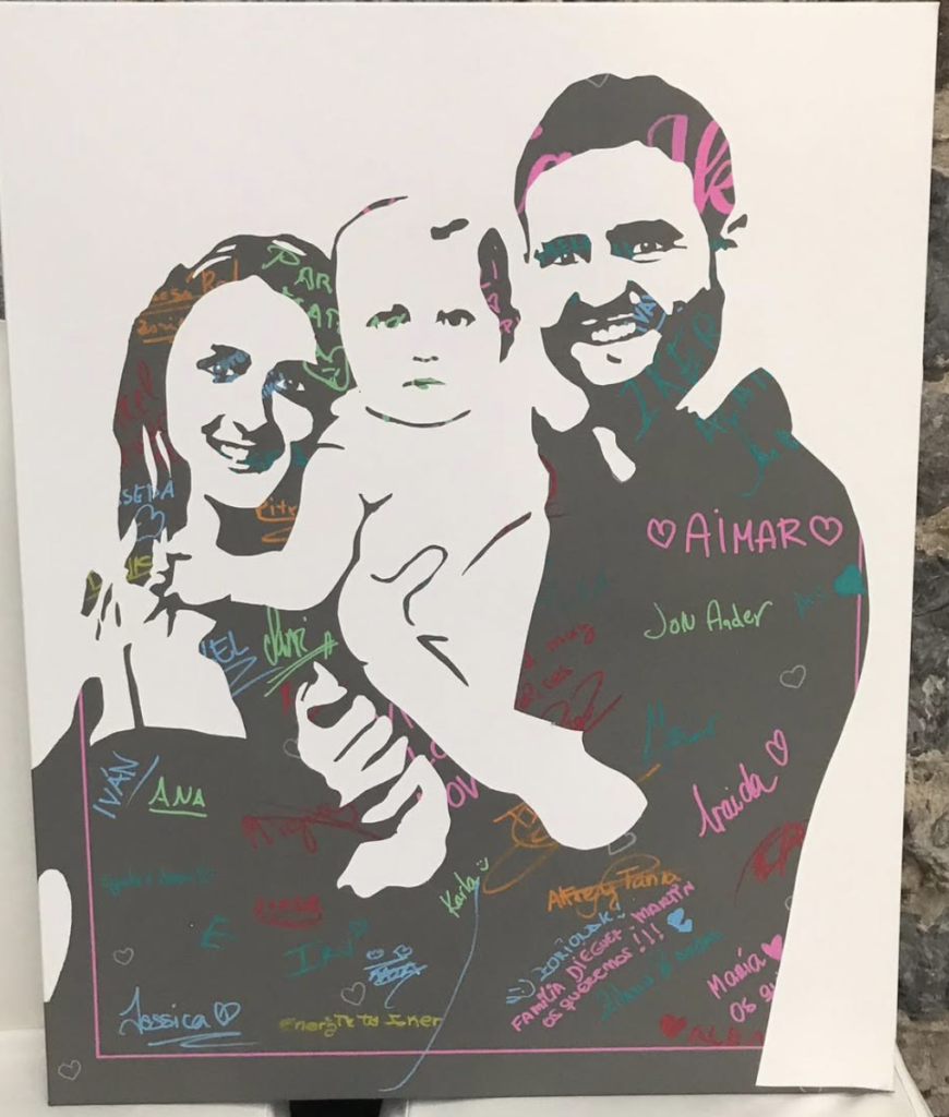 Custom family portrait revealed during wedding entertainment in Spain.