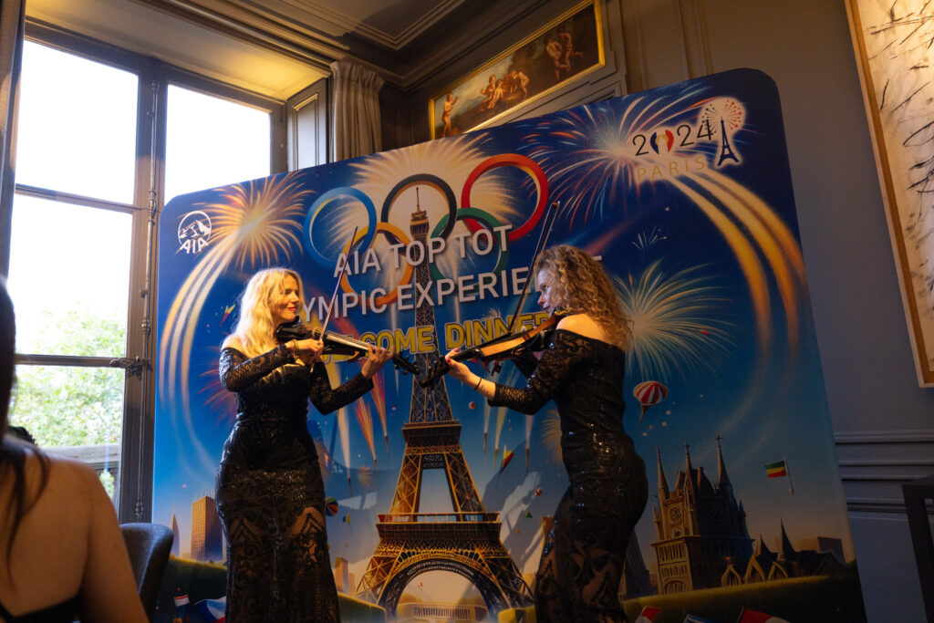 Classical string duo performing at a corporate event in Paris